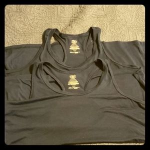 Two identical racer back athletic tank tops